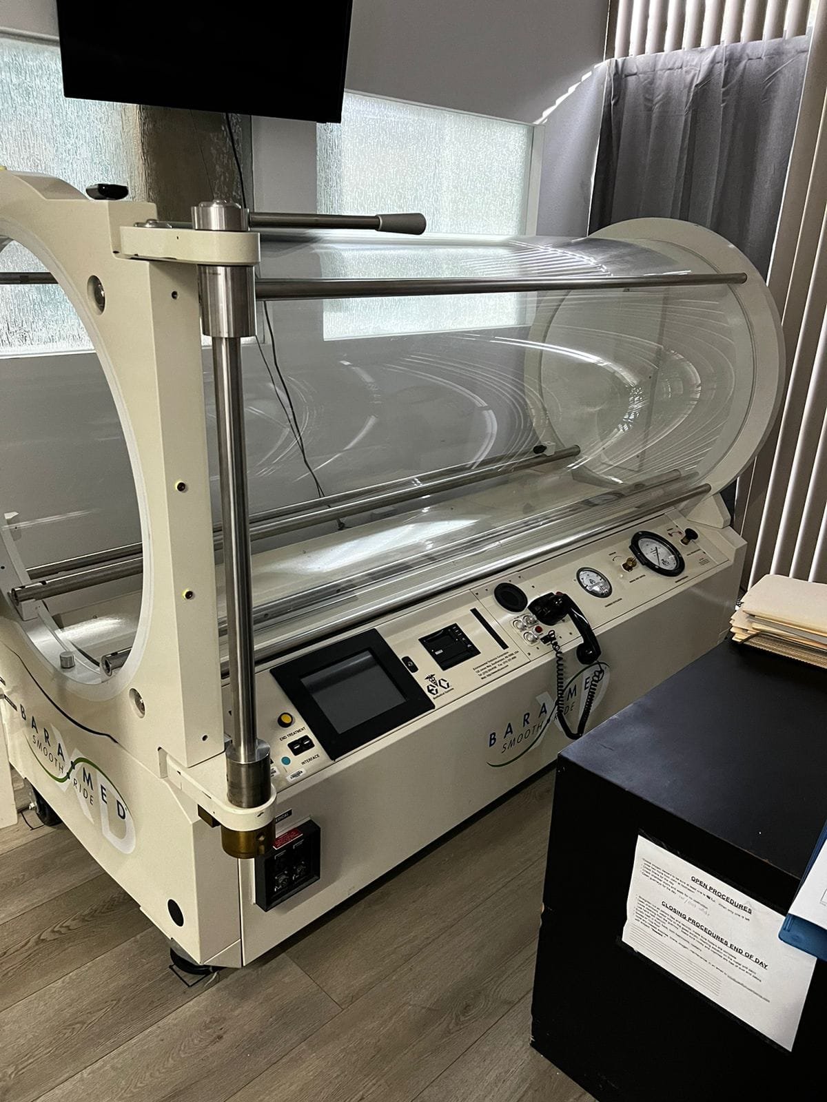 White medical-grade hyperbaric chamber at Pacific Hyperbarics — Monterey